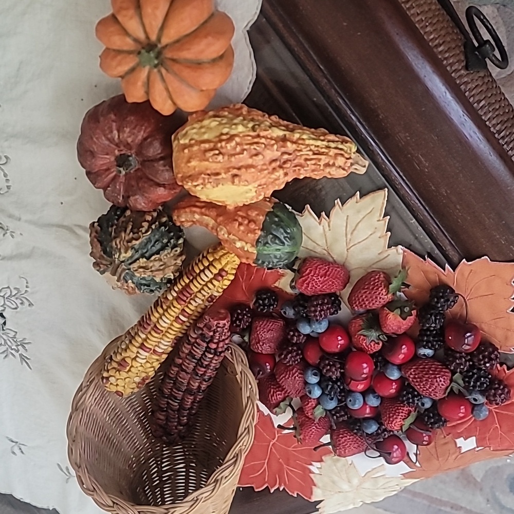 Seasonal display gourds, corn, fruit, etc.
